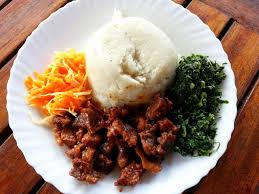 Traditional Ugali served with cabbage — the national dish of Tanzania